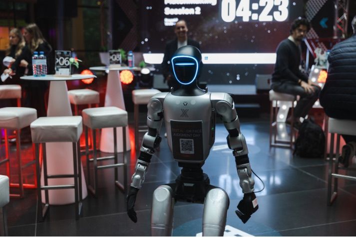 G1 Unitree humanoid robot among attendees